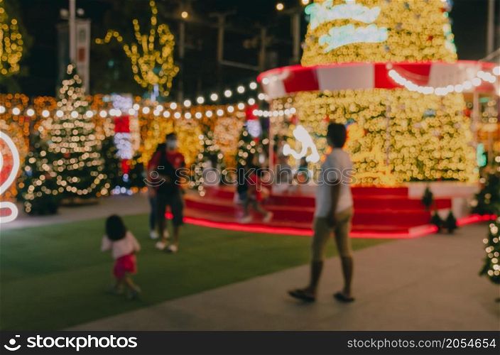 Blur Festival people Christmas abstract background. New year and Christmas party decorations with lights.