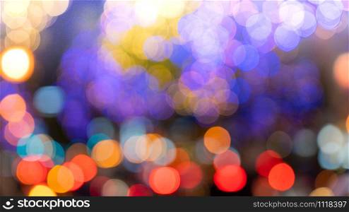 blur focused city night light filtered bokeh abstract background.de focus Decorative lights of the city during the festival.