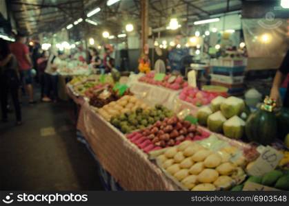 Blur fruit shop on the shelves in the market.as background.Vintage tone