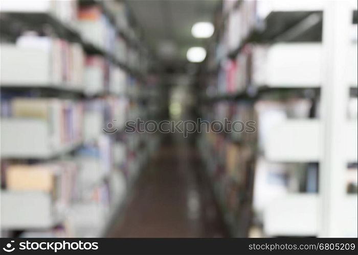 blur image of book shelf in library for use as background