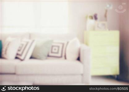 blur image of cozy sofa with geometric pattern pillows and sideboard in living corner with vintage effect