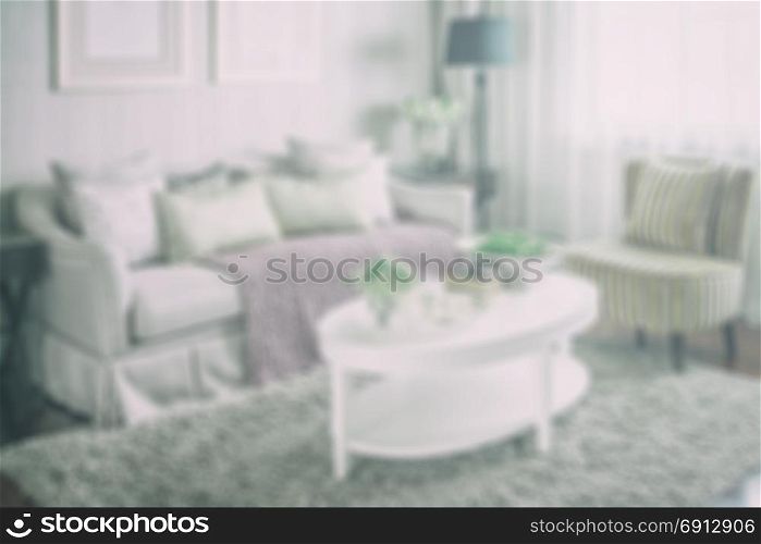 blur image of living room interior with set of elegant teacup