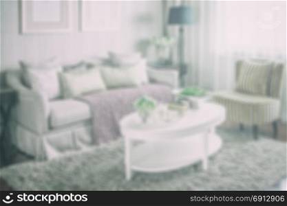 blur image of living room interior with set of elegant teacup