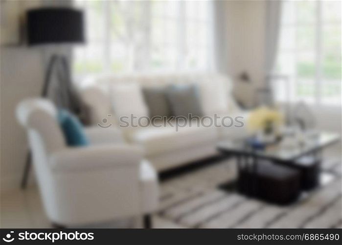 blur image of living room with white sofa