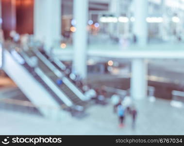 Blur image of modern building lobby with escalator. Business concept