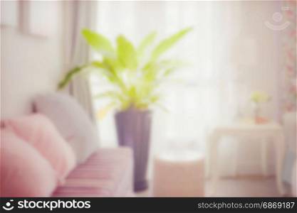blur image of sweet sofa set in the corner of the classic bedroom