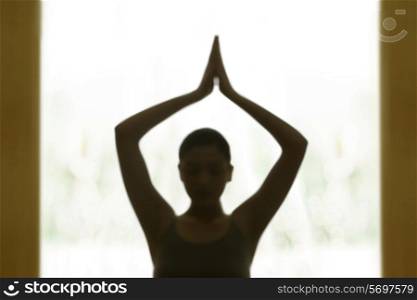 Blur image of woman meditating