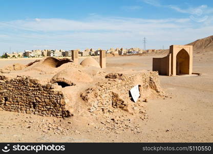 blur in iran near yazd the antique zoroastrian temple abandonated house and contruction