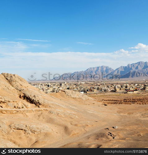 blur in iran near yazd the antique zoroastrian temple abandonated house and contruction