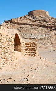 blur in iran near yazd the antique zoroastrian temple abandonated house and contruction