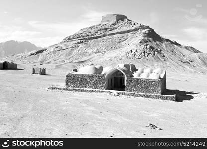 blur in iran near yazd the antique zoroastrian temple abandonated house and contruction