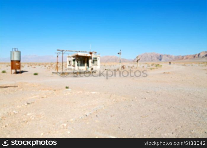 blur in iran old gas station the desert mountain background and nobody