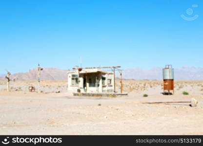 blur in iran old gas station the desert mountain background and nobody