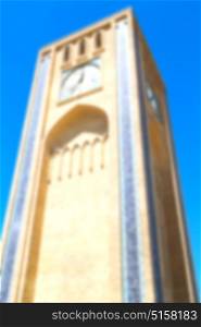 blur in iran old yazd city and the antique brick clock tower near the sky
