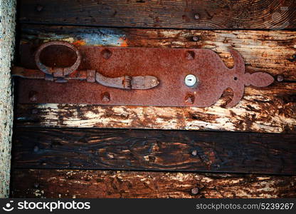 blur in italy antique door entrance and decorative handle for background