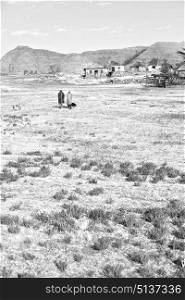blur in lesotho malealea street village near mountain and coultivation field