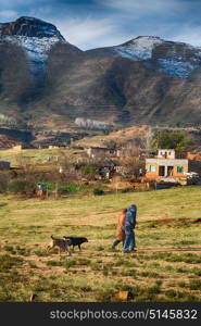 blur in lesotho malealea street village near mountain and coultivation field