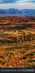 blur in lesotho malealea street village near mountain and coultivation field