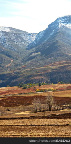 blur in lesotho malealea street village near mountain and coultivation field