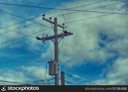 blur in philippines a electric pole with transformer and wire the cloudy sky