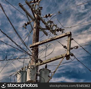 blur in philippines a electric pole with transformer and wire the cloudy sky