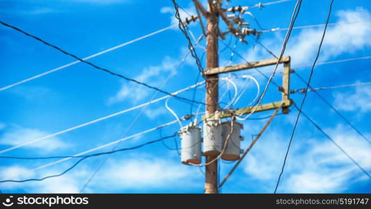 blur in philippines a electric pole with transformer and wire the cloudy sky