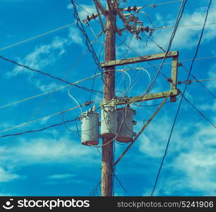 blur in philippines a electric pole with transformer and wire the cloudy sky