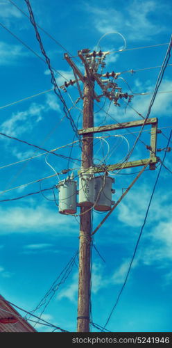 blur in philippines a electric pole with transformer and wire the cloudy sky