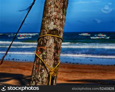 blur in philippines a rope from an hammock near the ocean shore and cloud