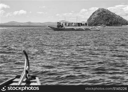 blur in philippines view of the island hill from the prow of a boat