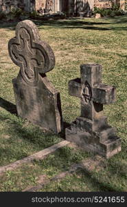 blur in south africa cape town antique grave cemetery cross stone and grass