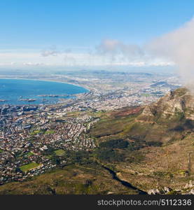 blur in south africa cape town city skyline from table mountain sky ocean and house