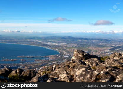 blur in south africa cape town city skyline from table mountain sky ocean and house