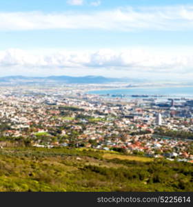 blur in south africa cape town city skyline from table mountain sky ocean and house