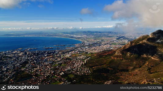 blur in south africa cape town city skyline from table mountain sky ocean and house