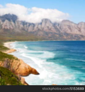 blur in south africa coastline indian ocean near the mountain and beach with pkant and bush