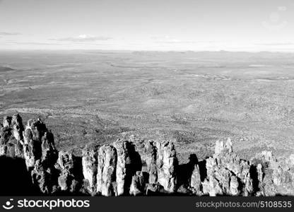 blur in south africa valley of desolation dirty road rock tree and sky