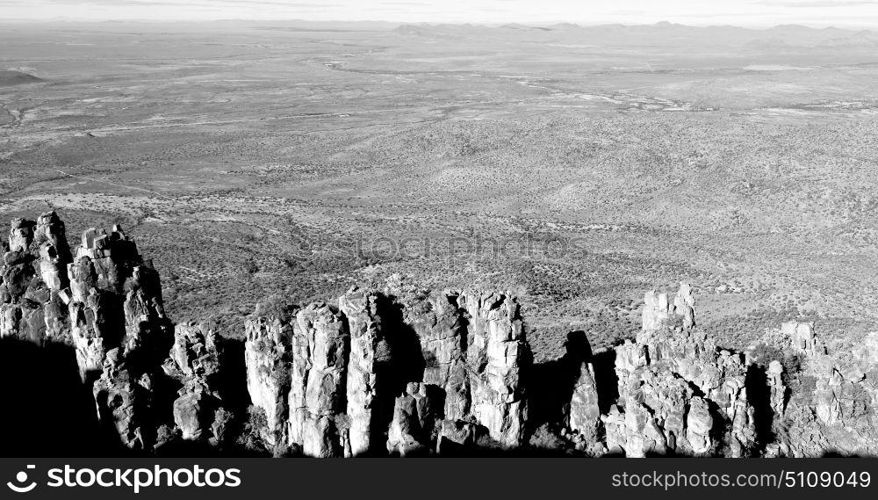 blur in south africa valley of desolation dirty road rock tree and sky