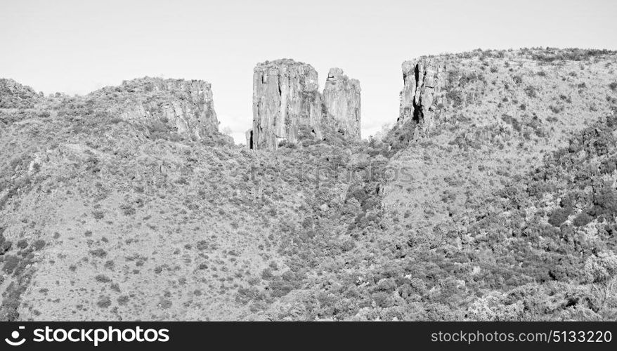 blur in south africa valley of desolation dirty road rock tree and sky