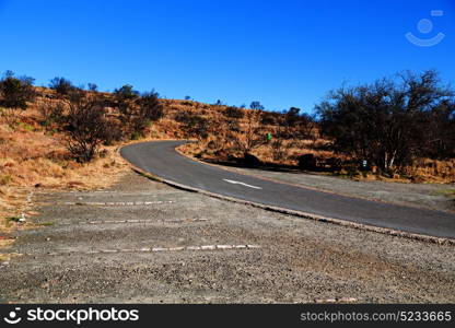 blur in south africa valley of desolation dirty road rock tree and sky