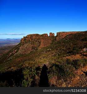 blur in south africa valley of desolation dirty road rock tree and sky