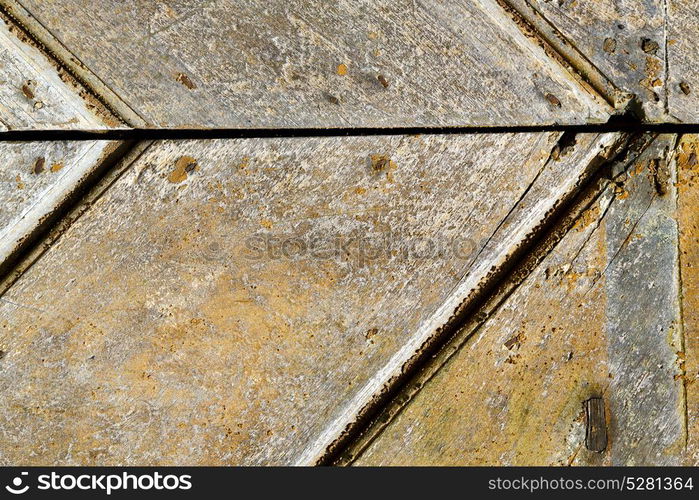 blur lombardy arsago seprio abstract rusty brass brown knocker in a door curch closed wood italy