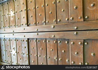blur lombardy arsago seprio abstract rusty brass brown knocker in a door curch closed wood italy cross
