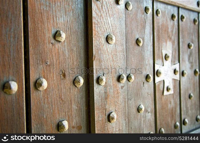 blur lombardy arsago seprio abstract rusty brass brown knocker in a door curch closed wood italy cross