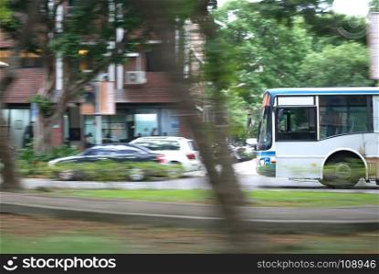 Blur motion of bus driving on road during rush hour