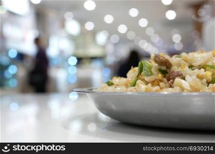 Blur motion of people eating foods at food court area inside mall