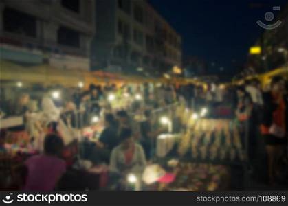blur night festival on street for background usage .vintage tone