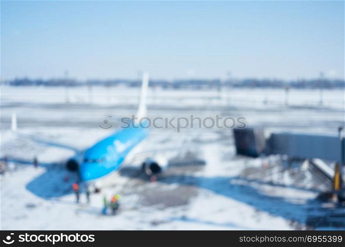 Blur of airplane at airport gate for background. Blur of airplane at airport gate abstract background