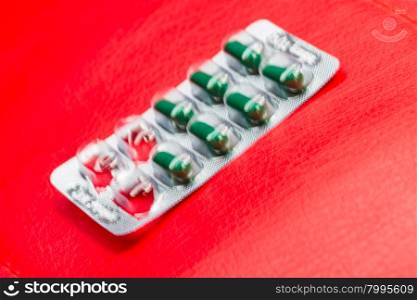 blur of pill and capsule of antibiotics in blister packaging