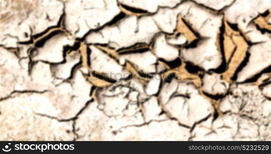 blur old desert and the abstract cracked sand texture in oman rub al khali